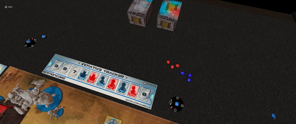 TTS screenshot of the ignition:core module: a a table with some square boxes and grey chibi miniatures with either red or blue bases.