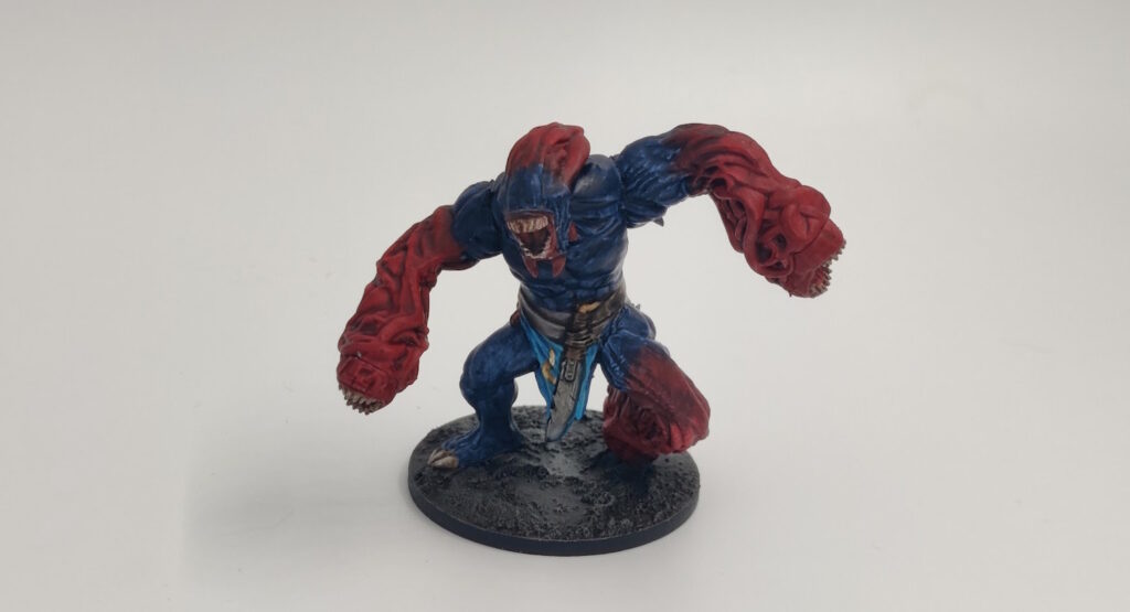 Mantic Ravager. Blue body, red limbs and "hair"