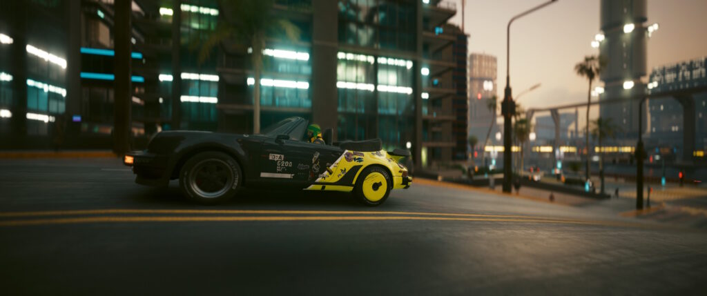 Cyberpynk 2077 screenshot: V is riding a black/yellow Porche 911 because Johnny Silverhand has politics as coherent as anarcho-capitalism.