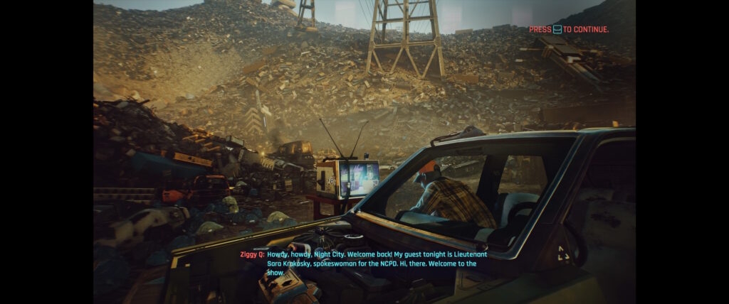 Cyberpunk 2077 screenshot: loading screen showing a junkyard